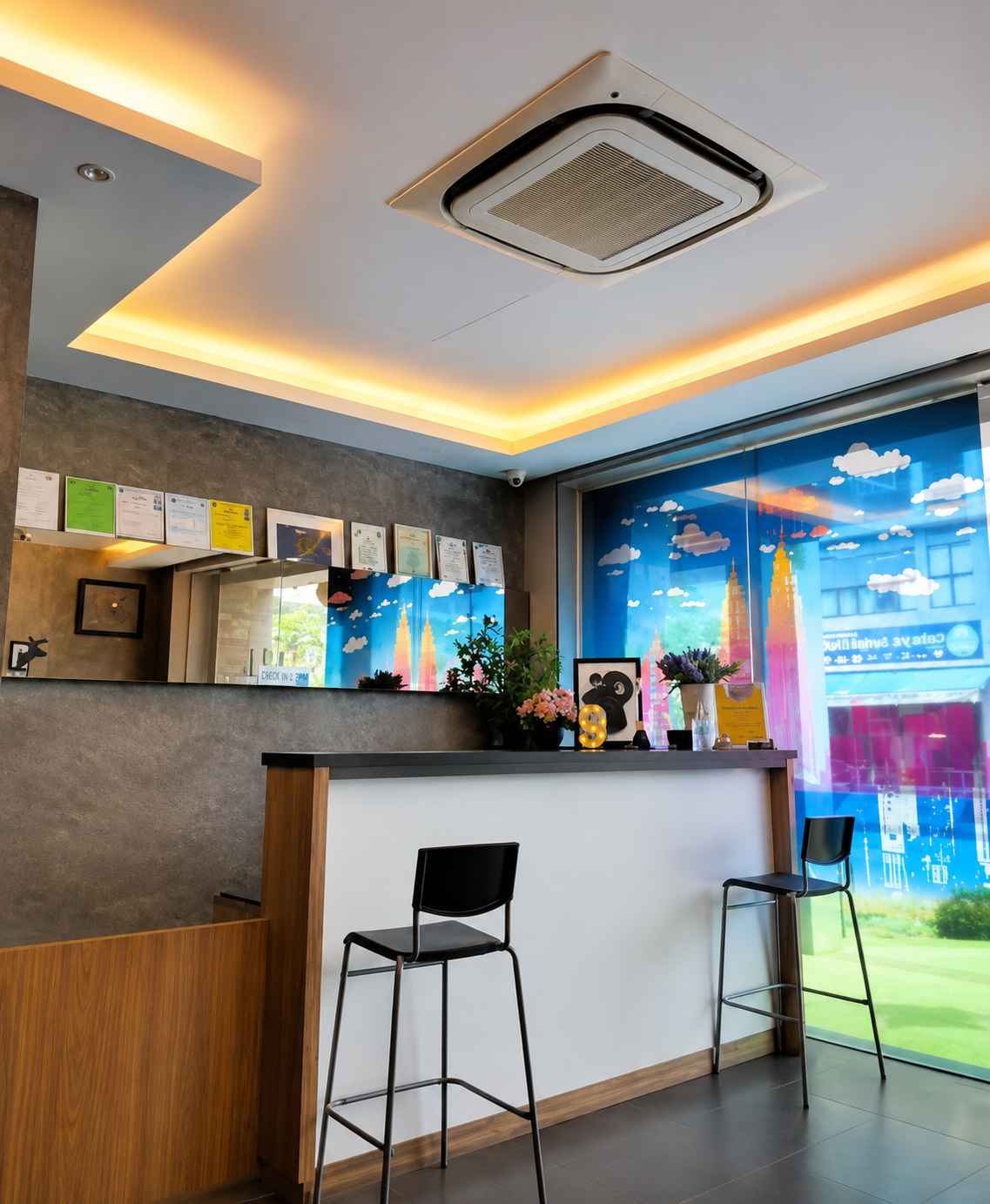 Front desk of 9 Square Hotel Subang with seating at the reception counter